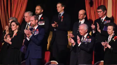 PA Media The royals give a standing ovation from their Royal Albert Hall box