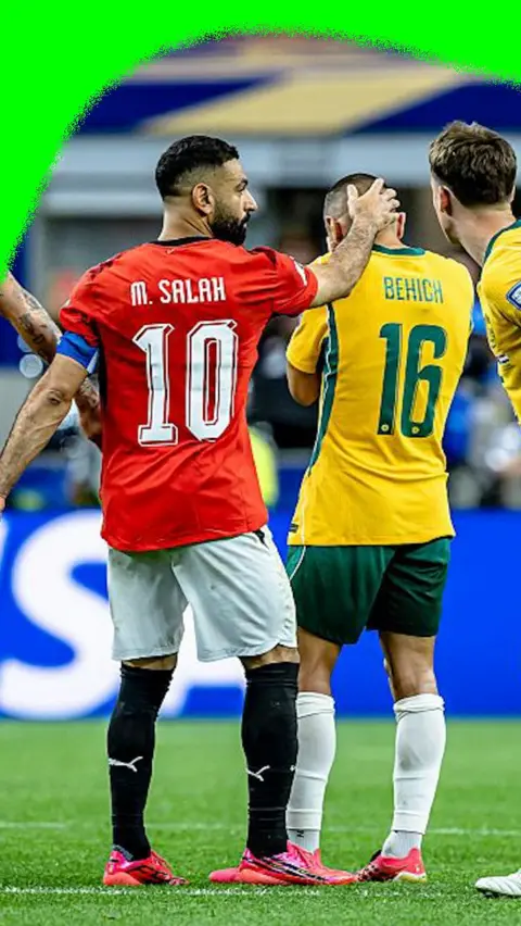 Mo Salah holding the back of the head of an Australian player after their 2026 World Cup match