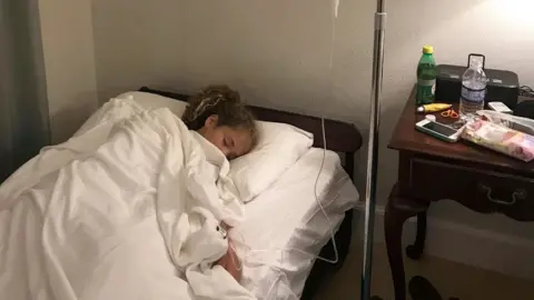 SWNS Amelia on a drip