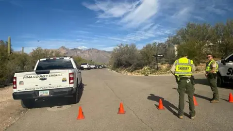 Police cars on a street in Tucson
