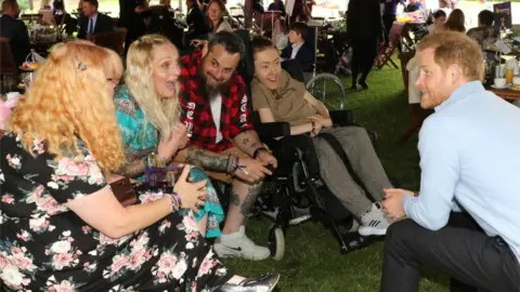 Antony Thompson / TWM Prince Harry and an award winner