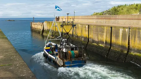 Getty Images Scottish fishing boat leaving Eyemouth