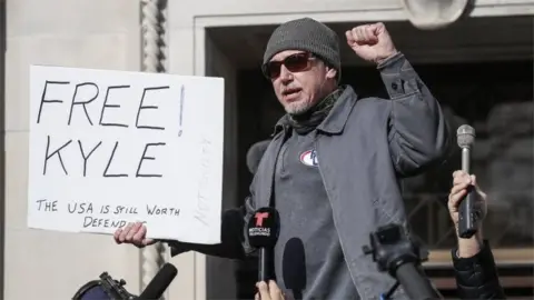 Reuters A Rittenhouse supporter outside court