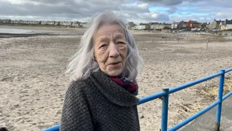 Sheila Harrison on the shore at Newbiggin