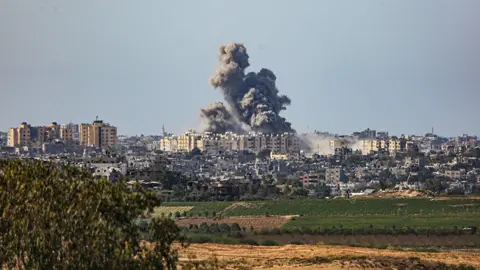 Getty Images Smoke rises above Beit Hanoun after an Israeli aerial attack on the area - 21 October 2023