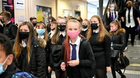 Getty Images Pupil at Rosshall Academy wears a face coverings as it becomes mandatory in corridors and communal areas on August 31, 2020 in Glasgow, Scotland