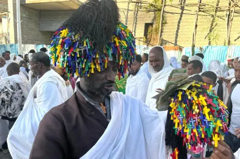 Man selling crucifixes