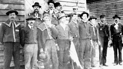 Courtesy of the State Archives of North Carolina Red Shirts pose at the polls in North Carolina