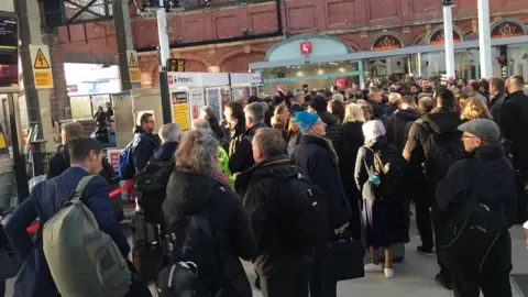Passengers at Norwich railway station after a train cancellation