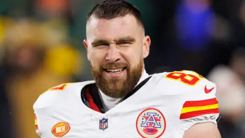 Reuters Dec 3, 2023; Green Bay, Wisconsin, USA; Kansas City Chiefs tight end Travis Kelce looks on during warmups prior to the Green Bay Packers against the Green Bay Packers at Lambeau Field.