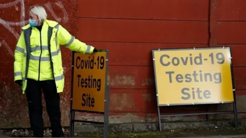 Reuters A woman at a Covid-19 testing site