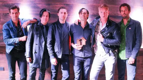 Official Charts Company Queens of the Stone Age and Mark Ronson