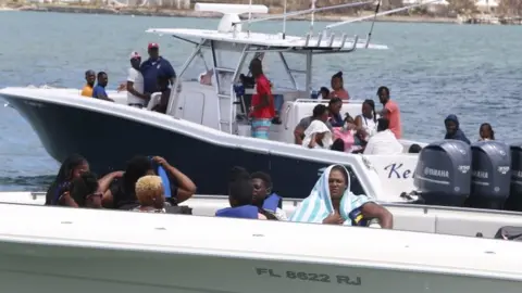 Getty Images Hurricane Dorian survivors board private boats to be evacuated from Great Abaco Island