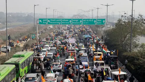 REUTERS/Danish Siddiqui Farmers take part in a tractor rally