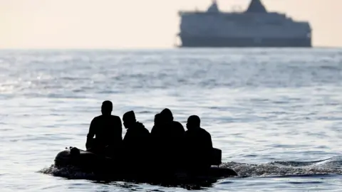 Reuters A boat carrying migrants in the English Channel