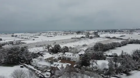 Jersey airport reopens after snow closes runway