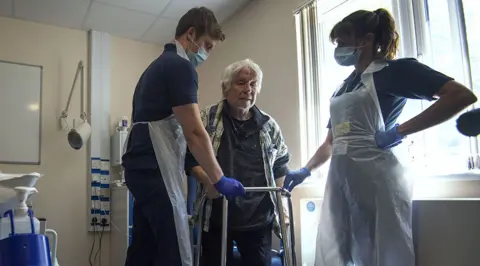 Getty Images Hospital staff carry out physiotherapy