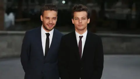 Getty Images Liam Payne and Louis Tomlinson arrive at the "Cinderella Ball" at the National History Museum in 2015