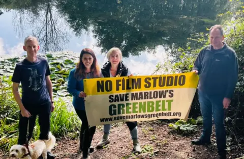 Joy Morrissey  Campaigners with Joy Morrissey (second left) holding a banner