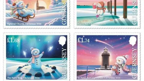 Guernsey Post Four of Guernsey's Christmas stamps. All have 'Guernsey' written down the right hand side under the head of King Charles III. They show a snowman and snowchild wearing a multi-coloured hat, scarf and gloves. The snowman is on a sledge at Torteval Church, the snowchild is standing in a puddle at Vazon Bay (stamp price no visible in the picture) and standing in The Fairy Ring (£1.68) and both of them are hugging at St Peter Port Lighthouse (£1.74). 