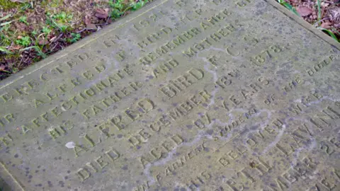 A memorial stone to Alfred Bird who died in December 1878