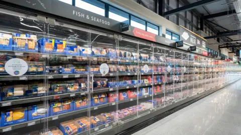 Aldi An empty fish and seafood aisle in an Aldi store