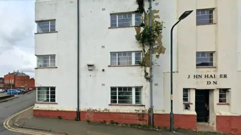 Google A now derelict four-storey 1930s block of social housing