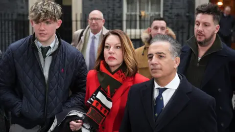 PA Media/Jordan Pettitt An image of Emma Webber, the mother of Barnaby Webber (centre) James Coates, the son of Ian Coates (back right) and the the father of of Grace O'Malley-Kumar, Dr Sanjoy Kumar, who were killed by Valdo Calocane in Nottingham on June 13 2023