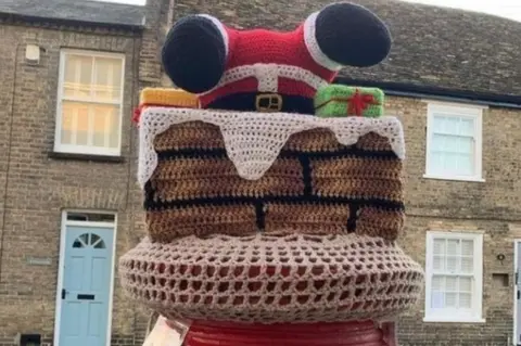 The Secret Yarn Bomber Ely postbox topper