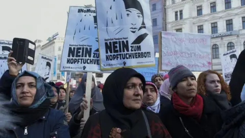 Getty Images Muslims and Austrian citizens attend a protest against the women headscarves ban proposed by the government country's ruling coalition in Vienna, Austria on February 04, 2017