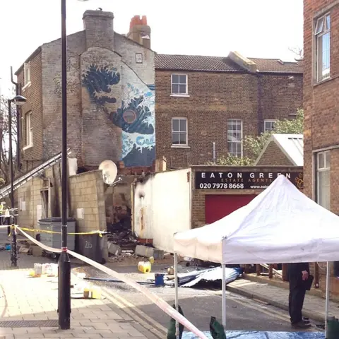 Tim Dickens / @brixtonblog The mural after the fire