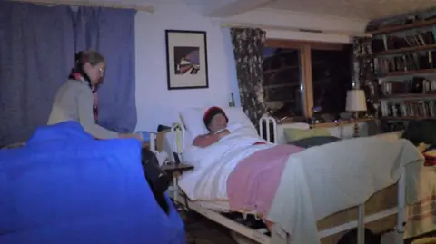 Andrew Sinclair/BBC Miranda Mugford looks after her husband Mike