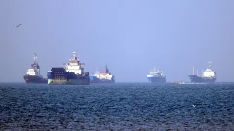 Ships in the distance in the Strait of Hormuz.