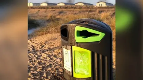 Dave Clark Bin on a beach