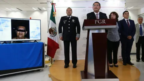 PGR A picture released by the prosecutor's office shows Alfredo Higuera speaking to the press