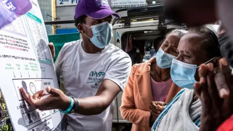 Getty Images Man explaining voting rules