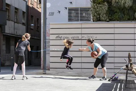 Miquel Benitez / Getty Images Children in Barcelona