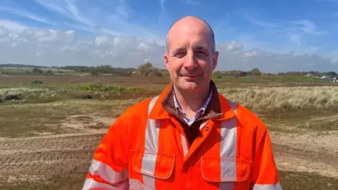 Richard Daniel/BBC Giles Bloomfield in orange high vis