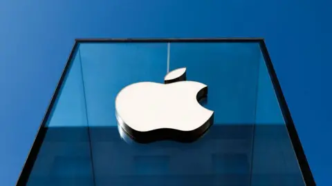 Getty Images Apple logo on a glass storefront in Milan, Italy