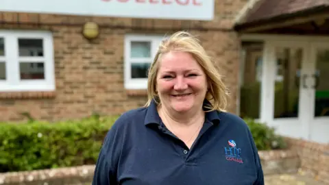 HTP Apprenticeship College Rachael Randall standing in front of the HTP college