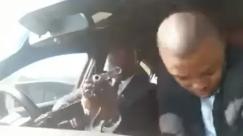 . Grab form video showing man with a gun