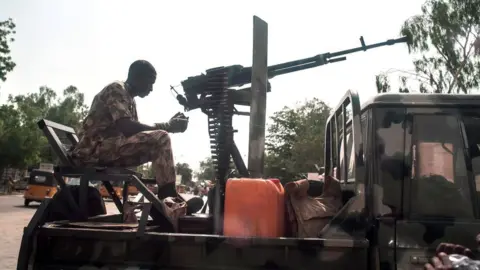 AFP A soldier sits on the back of an armed vehicle in Maiduguri in north-eastern Nigeria on July 7, 2017