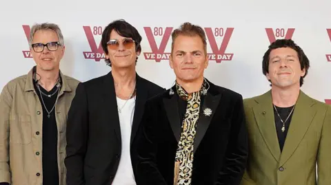 The band Toploader posing for a photo. 