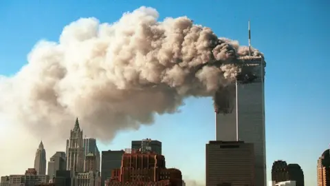 Getty Images Smoke pours from the World Trade Center -11 September 2011