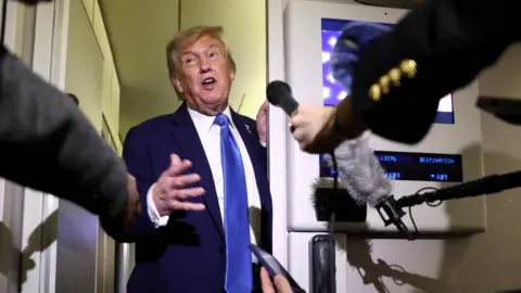 Reuters Donald Trump speaks to reporters aboard Air Force One after departing early from the the G7 summit in Canada