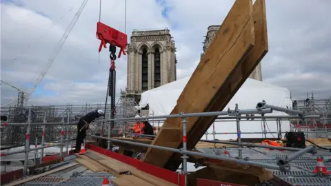 Romaric Toussaint © Etablissement public Rebâtir N Workers on the roof of Notre-Dame