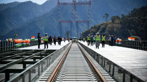Getty Images A view of newly constructed Chenab Bridge, World's highest Rail arch bridge of Indian Railways on Udampur- Srinagar-Baramulla-Rail link project during its media preview in Reasi district, on March 26, 2023 in Katra, India.