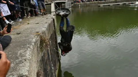 PA Media The Edward Colston statue was thrown into the river in Bristol