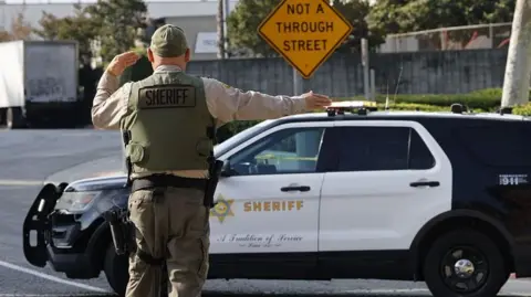 A police officer directing traffic outside the site of the blast. 