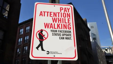 Getty Images Social media warning sign